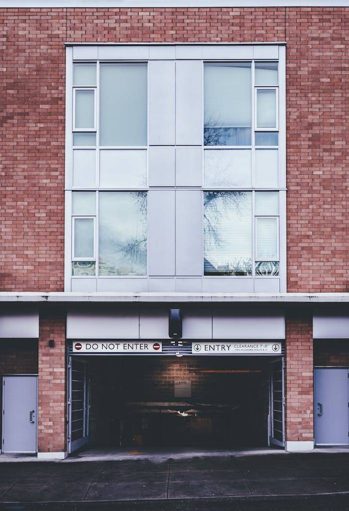 gallery-4 Exterior of brick building with entrance of indoor parking located in city in daylight